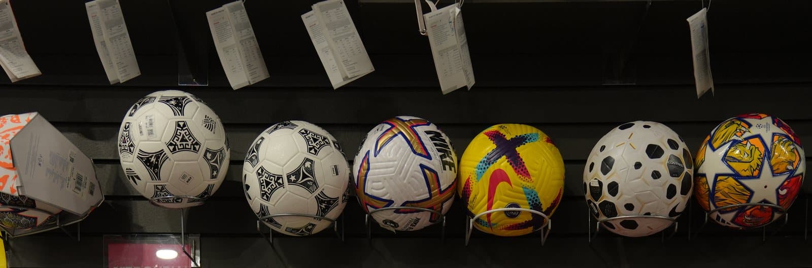 Wall of soccer match balls at Not Just Soccer